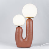 modern-resin-globe-table-lamp-with-sculptural-base-for-designer-home-decor