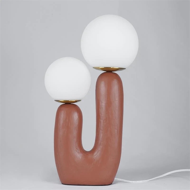 modern-resin-globe-table-lamp-with-sculptural-base-for-designer-home-decor