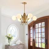 modern-ophelia-glass-globe-chandelier-with-wrought-iron-and-feather-detail-in-antique-gold