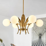 modern-ophelia-glass-globe-chandelier-with-wrought-iron-and-feather-detail-in-antique-gold
