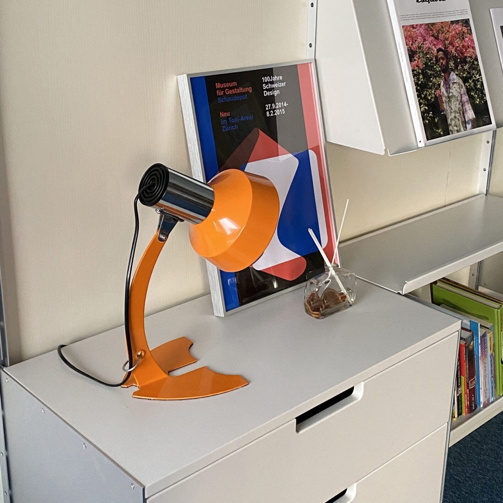 stylish-orange-and-chrome-metal-bedside-lamp-with-vibrant-apple-green-wire
