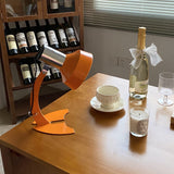 stylish-orange-and-chrome-metal-bedside-lamp-with-vibrant-apple-green-wire