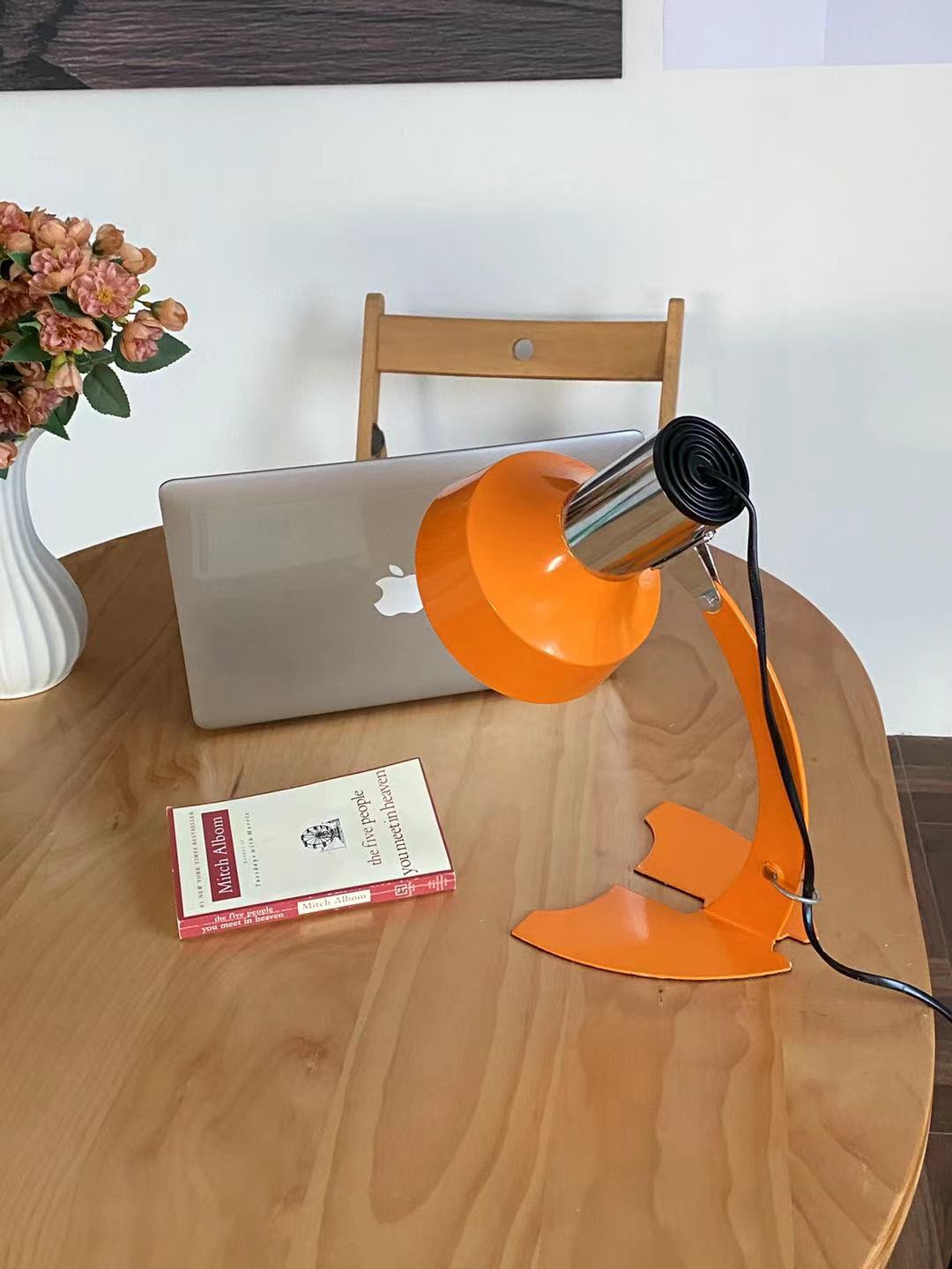 stylish-orange-and-chrome-metal-bedside-lamp-with-vibrant-apple-green-wire