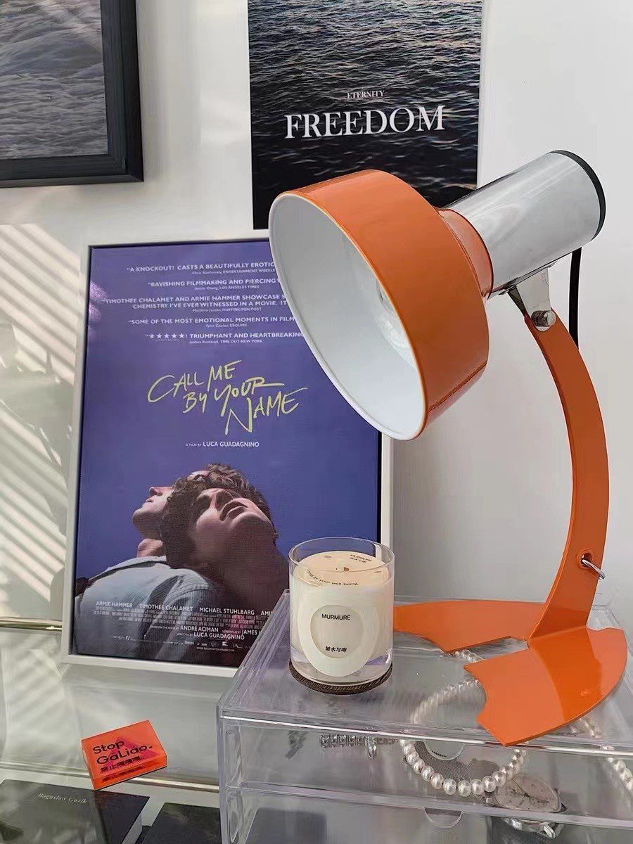 stylish-orange-and-chrome-metal-bedside-lamp-with-vibrant-apple-green-wire