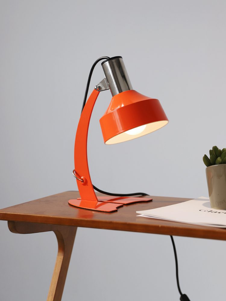 stylish-orange-and-chrome-metal-bedside-lamp-with-vibrant-apple-green-wire