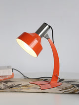 stylish-orange-and-chrome-metal-bedside-lamp-with-vibrant-apple-green-wire