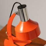 stylish-orange-and-chrome-metal-bedside-lamp-with-vibrant-apple-green-wire