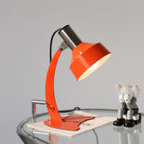 stylish-orange-and-chrome-metal-bedside-lamp-with-vibrant-apple-green-wire