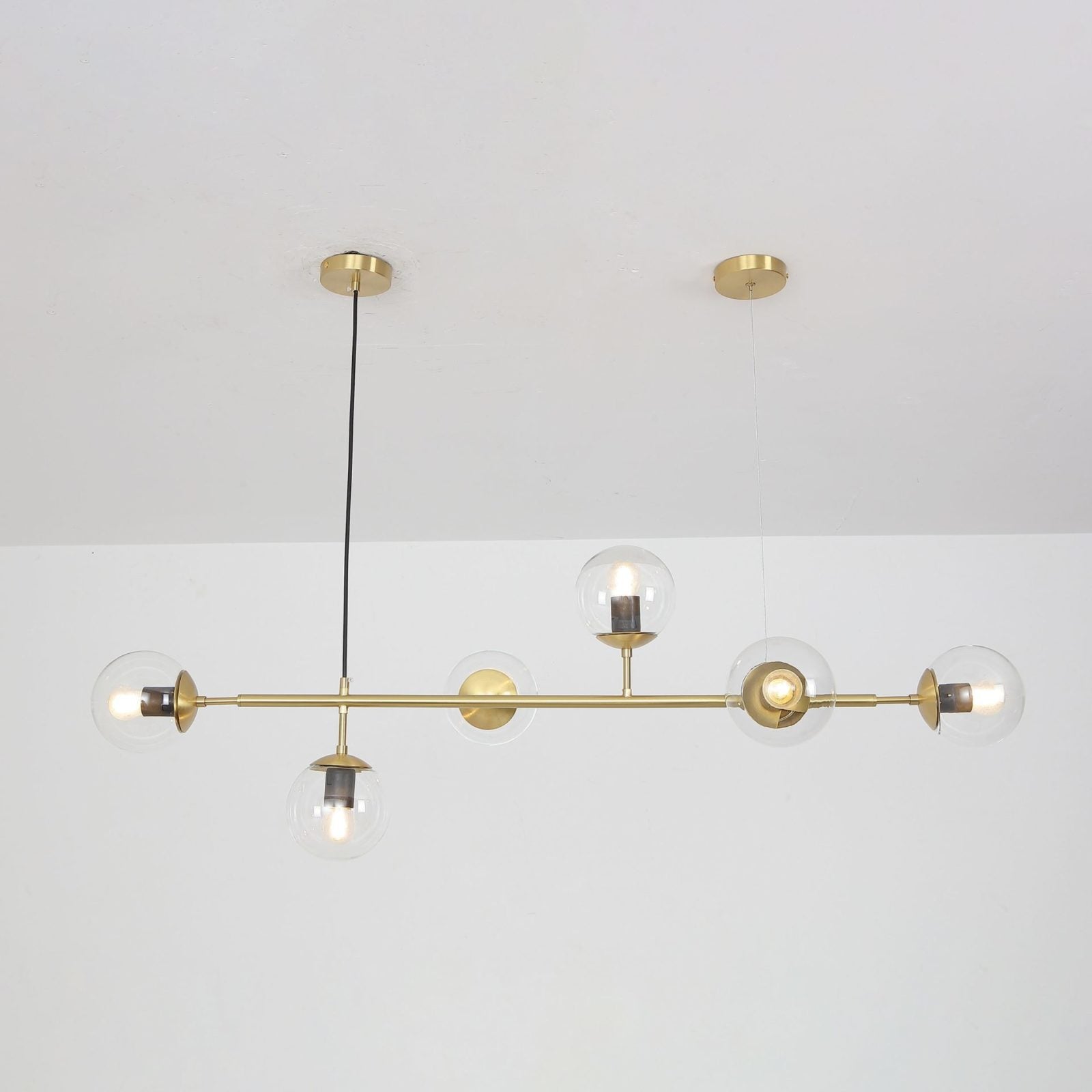 contemporary-multi-glass-globe-pendant-light-with-round-orb-shades-and-polished-brass-frame