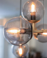 contemporary-multi-glass-globe-pendant-light-with-round-orb-shades-and-polished-brass-frame