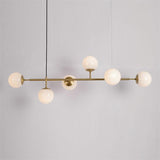 contemporary-multi-glass-globe-pendant-light-with-round-orb-shades-and-polished-brass-frame
