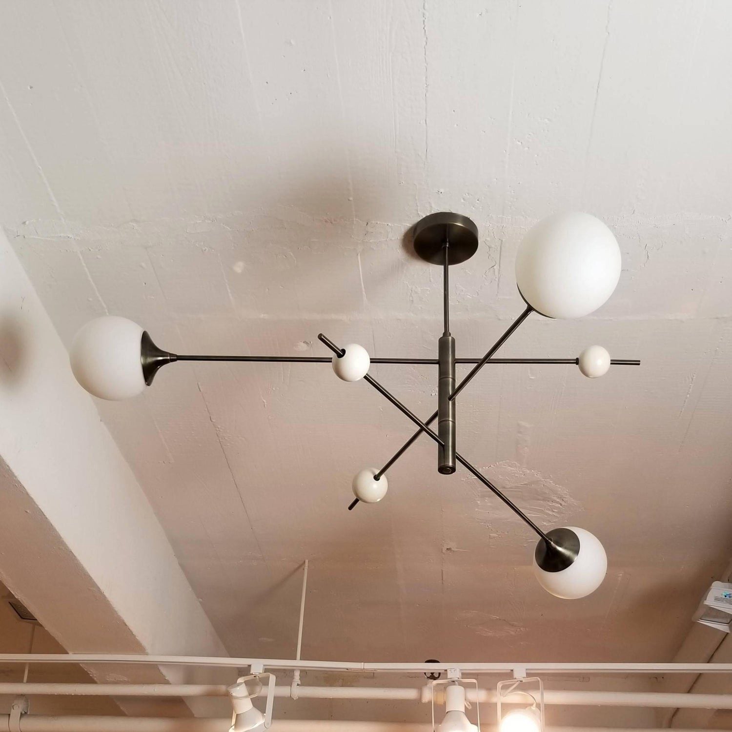 modern-orbital-3-arm-articulated-glass-globe-chandelier-in-copper-and-bronze-finish
