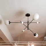 modern-orbital-3-arm-articulated-glass-globe-chandelier-in-copper-and-bronze-finish