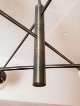 modern-orbital-3-arm-articulated-glass-globe-chandelier-in-copper-and-bronze-finish