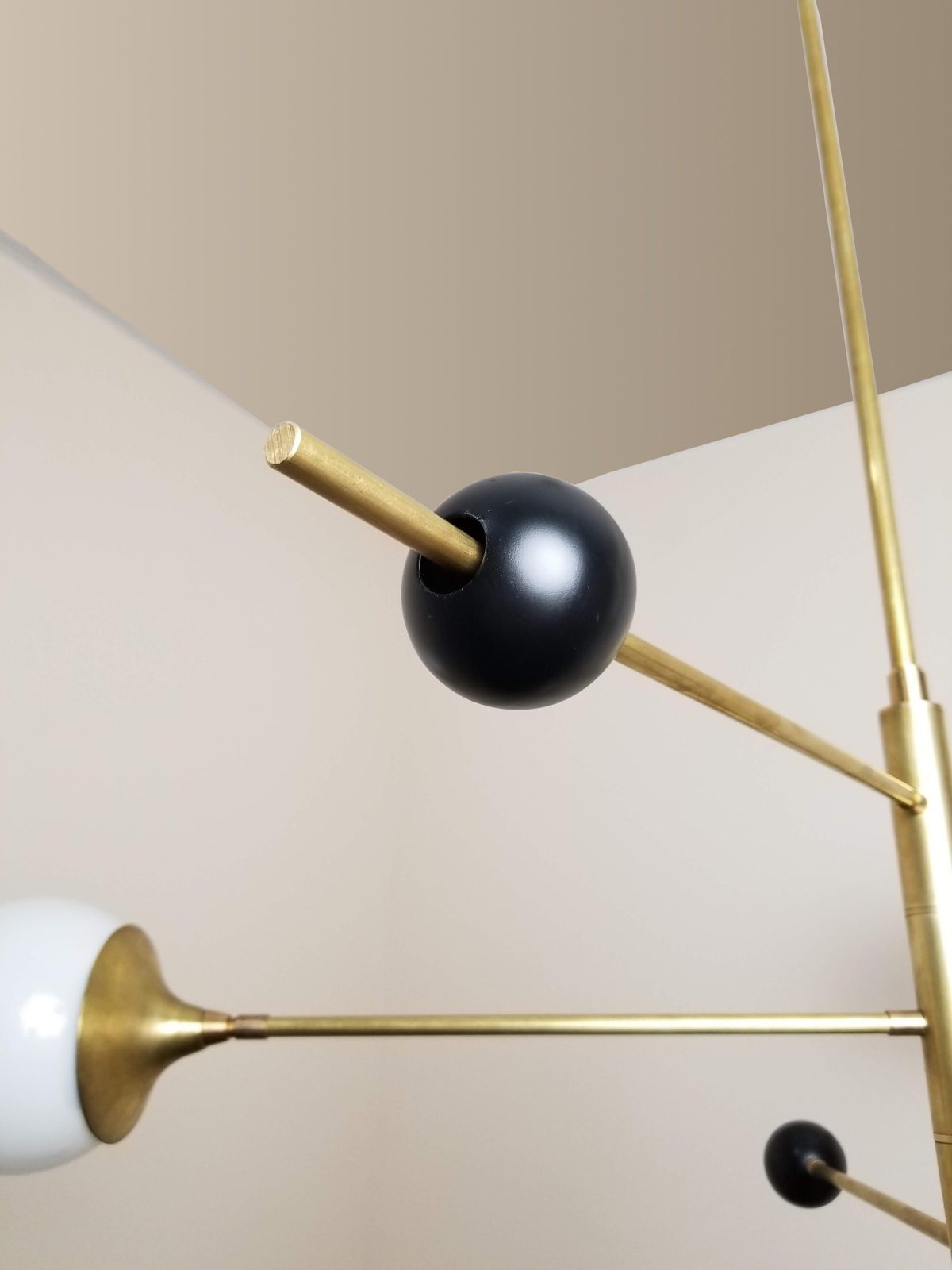 modern-orbital-3-arm-articulated-glass-globe-chandelier-in-copper-and-bronze-finish