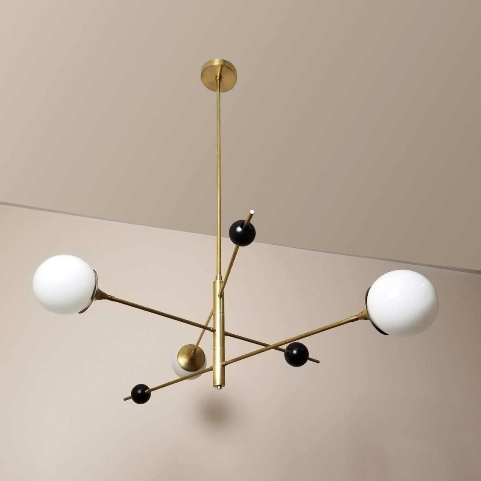 modern-orbital-3-arm-articulated-glass-globe-chandelier-in-copper-and-bronze-finish