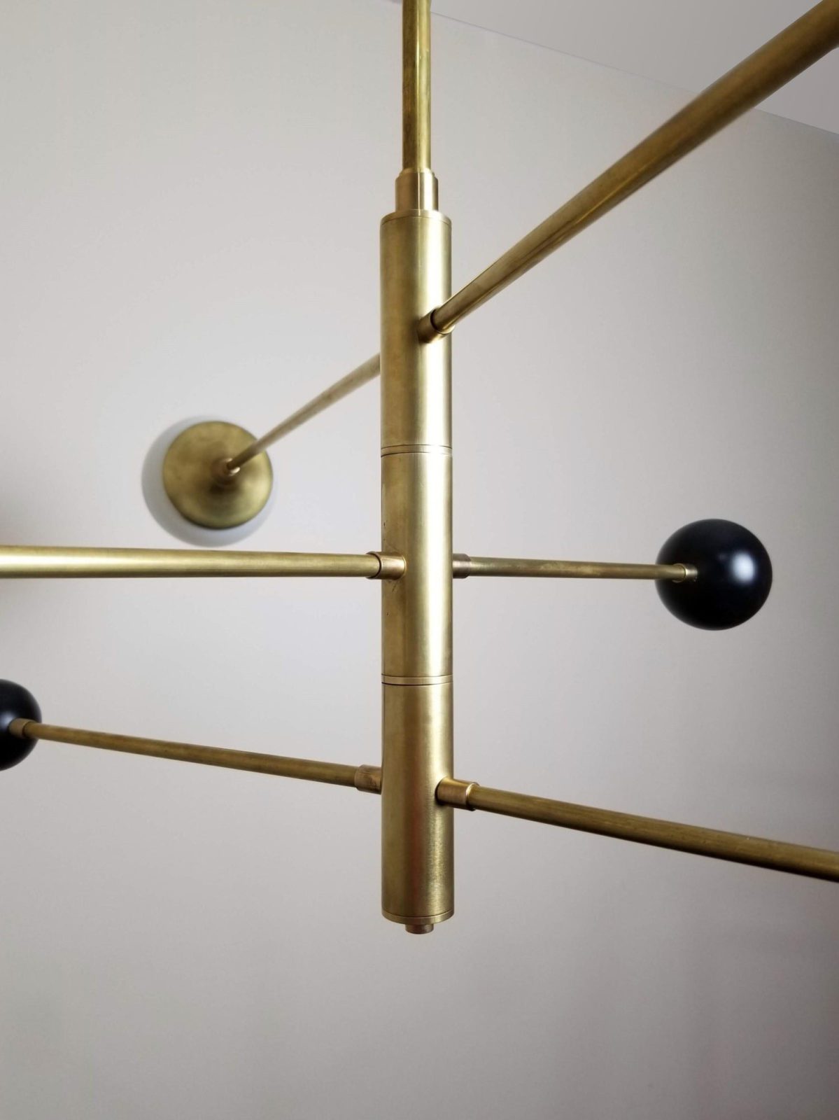 modern-orbital-3-arm-articulated-glass-globe-chandelier-in-copper-and-bronze-finish