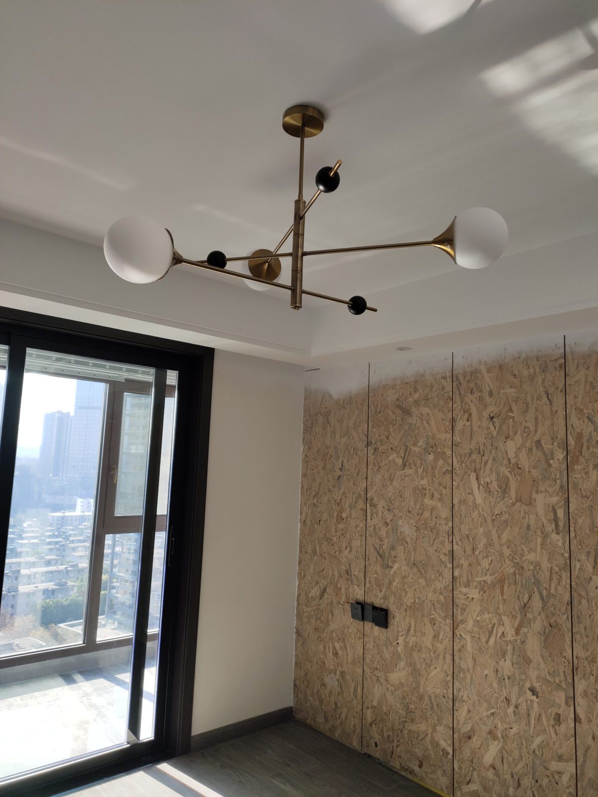 modern-orbital-3-arm-articulated-glass-globe-chandelier-in-copper-and-bronze-finish
