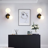 modern-minimalist-glass-globe-wall-sconce-brass-and-black-planeta-wall-lamp