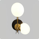 modern-minimalist-glass-globe-wall-sconce-brass-and-black-planeta-wall-lamp