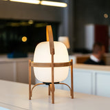 Modern Portable Glass Lantern Table Lamp with Wood Handle and Glass Shade for Ambient Lighting