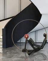 Modern Figurative Reader Sculpture LED Floor Lamp with Circular Frame and Ambient Lighting