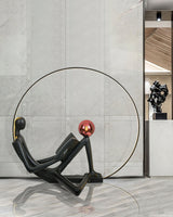 Modern Figurative Reader Sculpture LED Floor Lamp with Circular Frame and Ambient Lighting