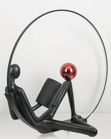 Modern Figurative Reader Sculpture LED Floor Lamp with Circular Frame and Ambient Lighting