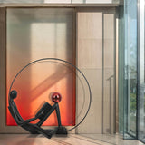 Modern Figurative Reader Sculpture LED Floor Lamp with Circular Frame and Ambient Lighting