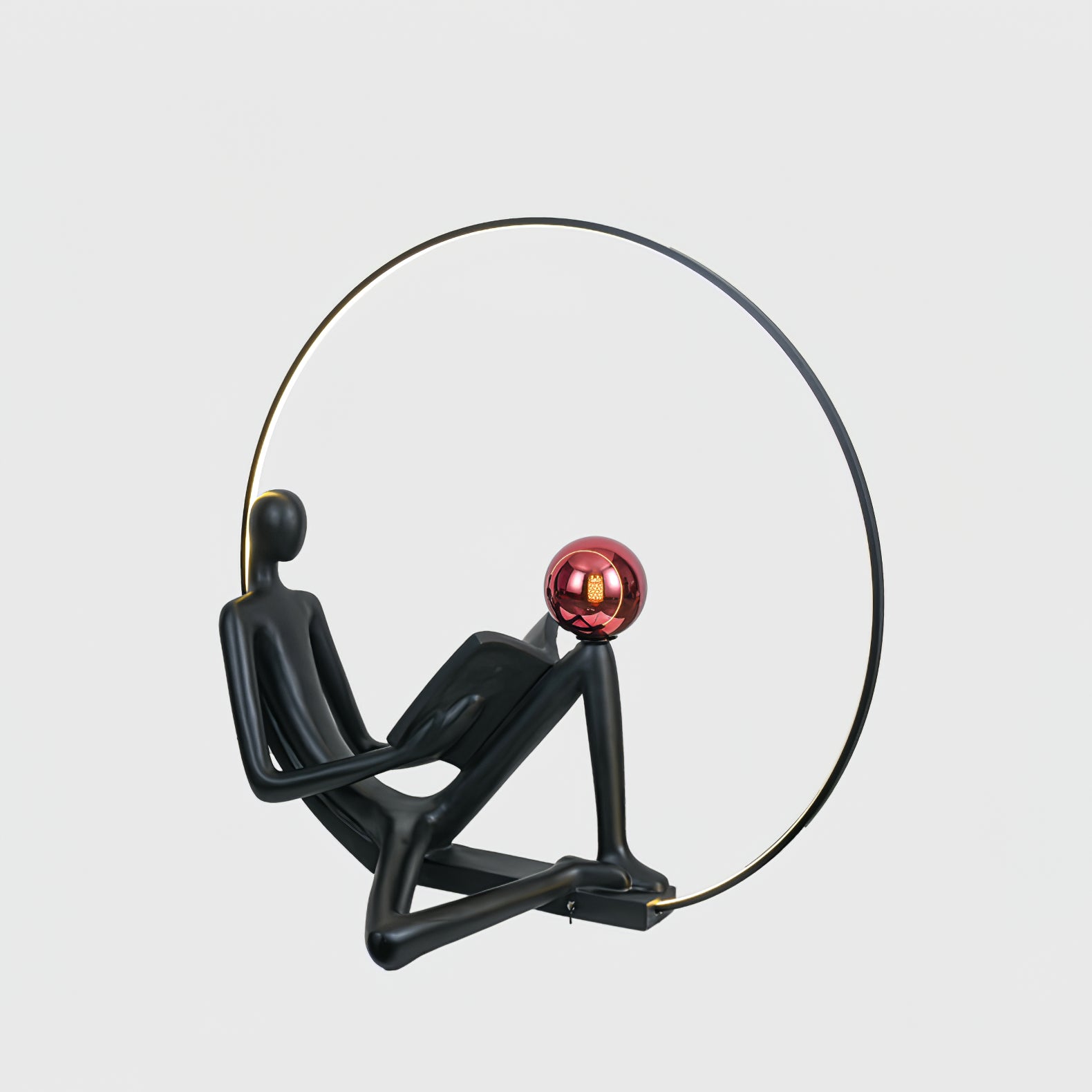 Modern Figurative Reader Sculpture LED Floor Lamp with Circular Frame and Ambient Lighting