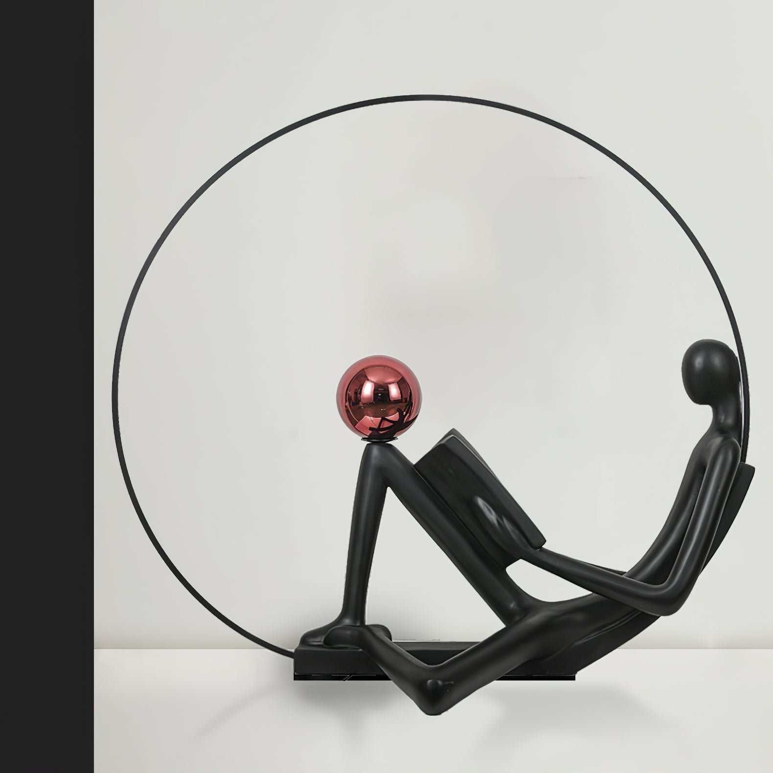 Modern Figurative Reader Sculpture LED Floor Lamp with Circular Frame and Ambient Lighting