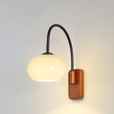 elegant-walnut-wood-wall-lamp-with-white-glass-globe-shade-for-indoor-lighting