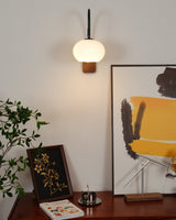 elegant-walnut-wood-wall-lamp-with-white-glass-globe-shade-for-indoor-lighting