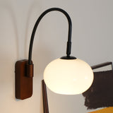 elegant-walnut-wood-wall-lamp-with-white-glass-globe-shade-for-indoor-lighting