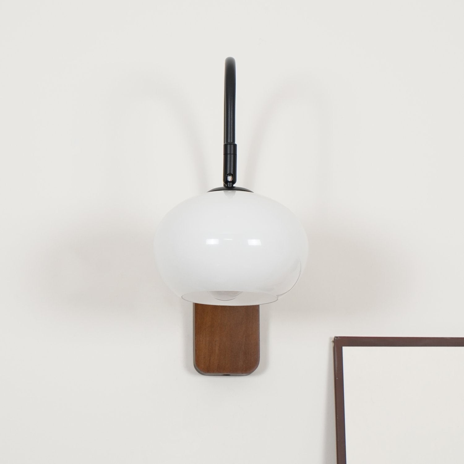 elegant-walnut-wood-wall-lamp-with-white-glass-globe-shade-for-indoor-lighting