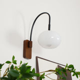 elegant-walnut-wood-wall-lamp-with-white-glass-globe-shade-for-indoor-lighting
