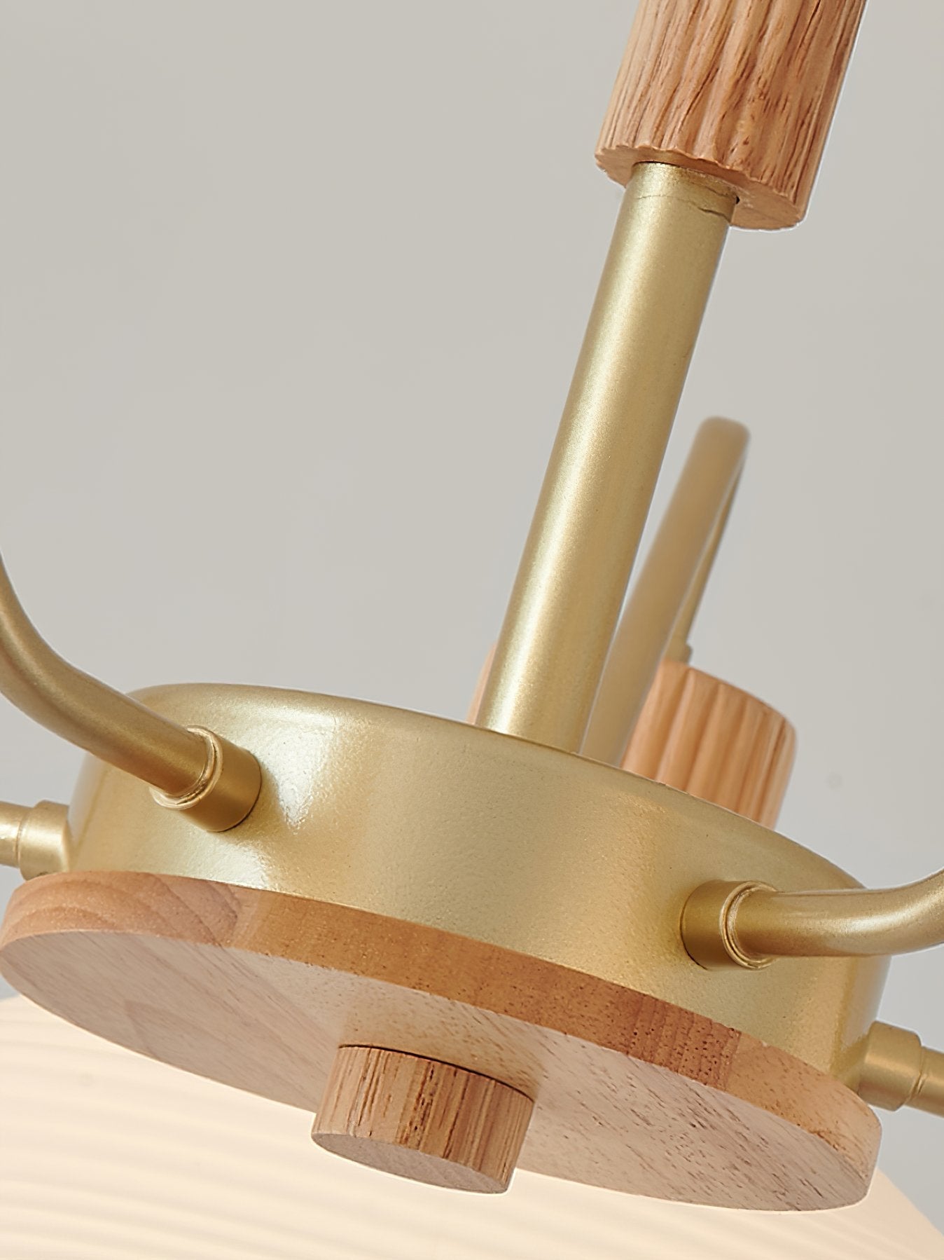 modern-ribbed-rubberwood-chandelier-with-white-glass-globes-and-gold-accents