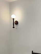 vintage-roman-column-wall-sconce-with-walnut-wood-accents-and-glass-shade-for-indoor-lighting