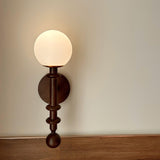 vintage-roman-column-wall-sconce-with-walnut-wood-accents-and-glass-shade-for-indoor-lighting
