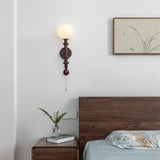 vintage-roman-column-wall-sconce-with-walnut-wood-accents-and-glass-shade-for-indoor-lighting