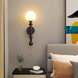 vintage-roman-column-wall-sconce-with-walnut-wood-accents-and-glass-shade-for-indoor-lighting