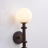 vintage-roman-column-wall-sconce-with-walnut-wood-accents-and-glass-shade-for-indoor-lighting