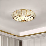 Modern Brass Flush Mount Ceiling Light with Textured Glass Shade for Indoor Spaces