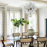 modern-hand-blown-glass-globe-chandelier-with-sculptural-metal-frame-for-living-room-and-foyer