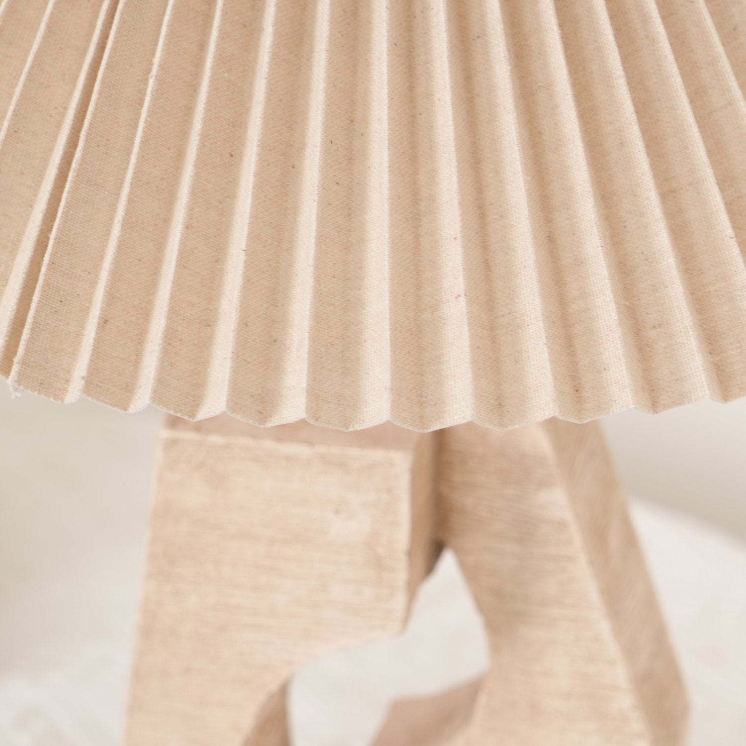 artistic-ruins-sculptural-resin-table-lamp-with-pleated-linen-shade-for-living-room