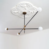 modern-hand-blown-glass-globe-chandelier-with-elegant-brass-and-copper-finishes