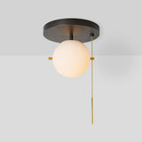 modern-signal-brass-ceiling-light-with-hand-blown-glass-globe-and-pull-switch