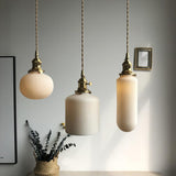 modern-shell-inspired-ceramic-pendant-light-art-deco-porcelain-hanging-lamp-with-brass-accents