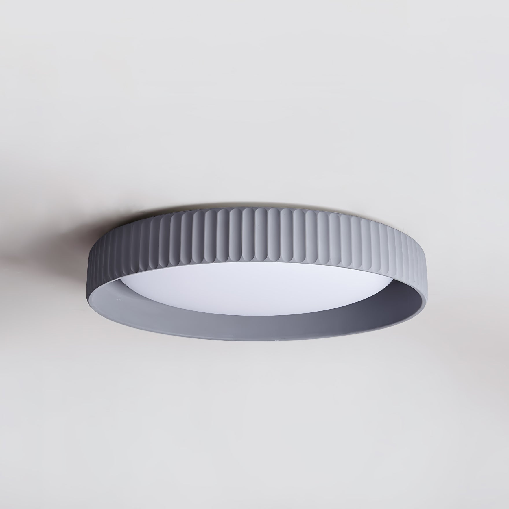 modern-round-ribbed-acrylic-led-flush-mount-ceiling-light-in-resin-frame