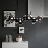 modern-linear-staggered-glass-orb-chandelier-for-dining-room-and-kitchen-island